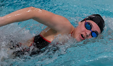 Young woman swims