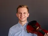 Joshua holds violin