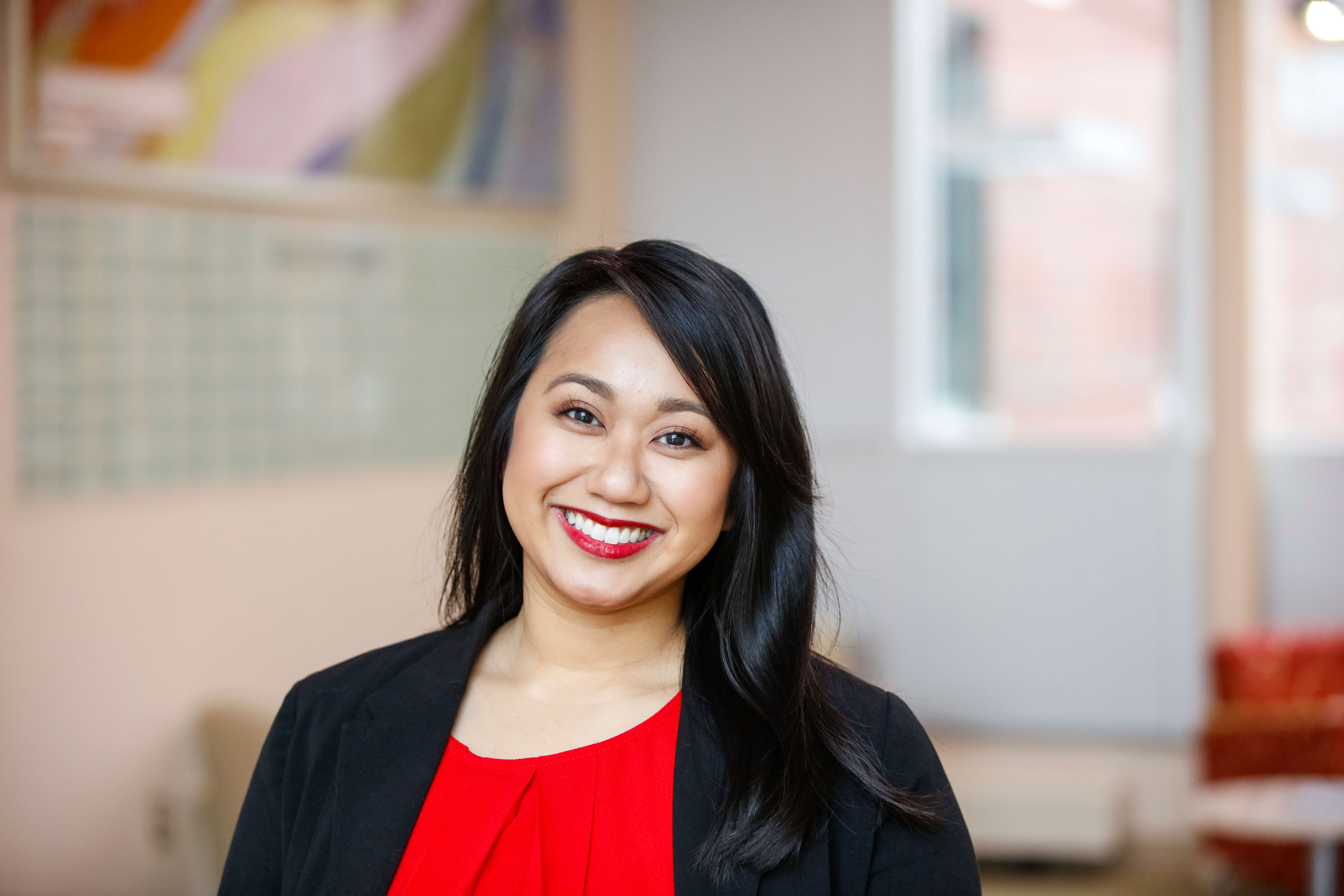 A smiling student of the adult programs