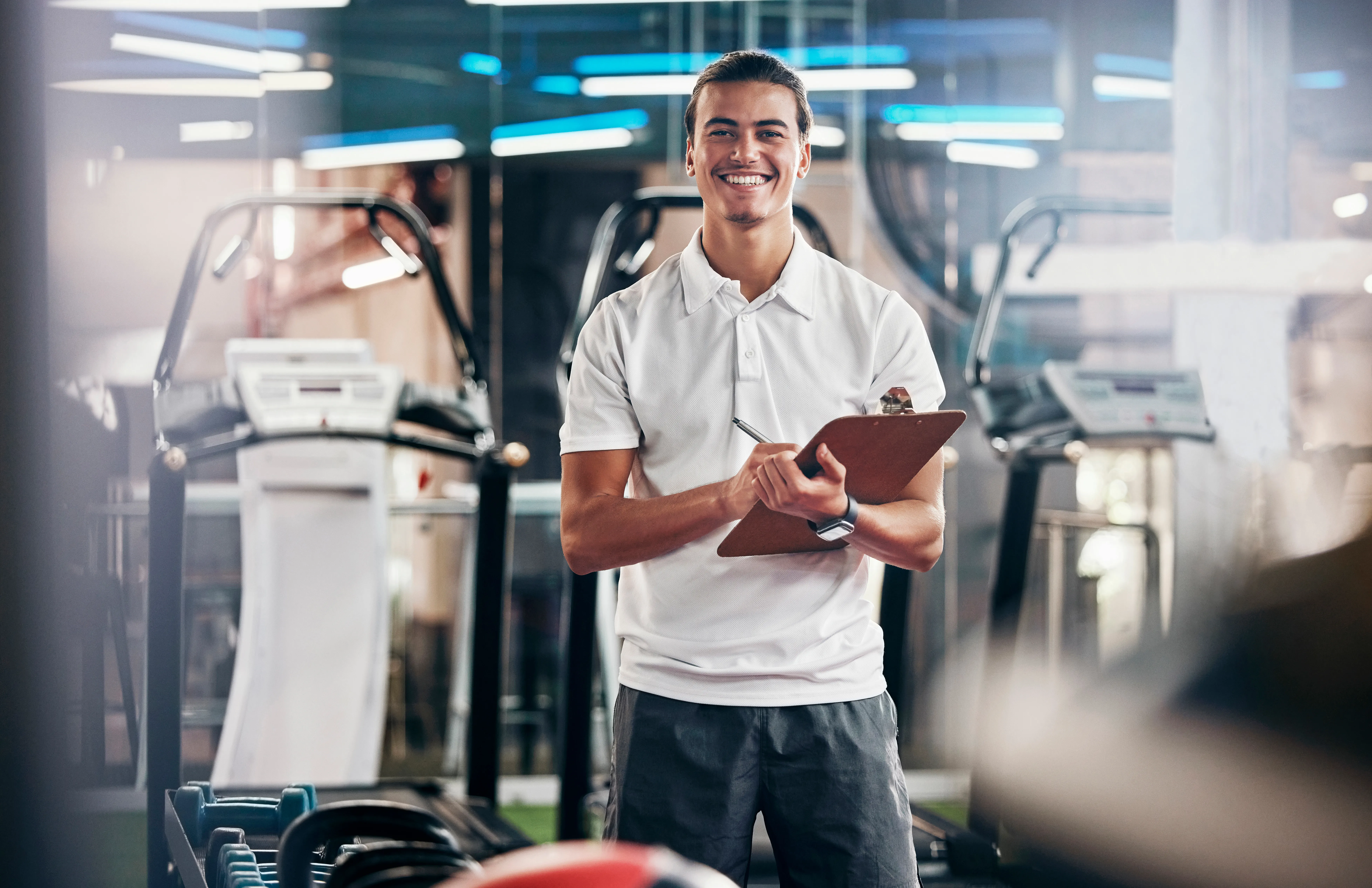A man surrounded by exercise equipment