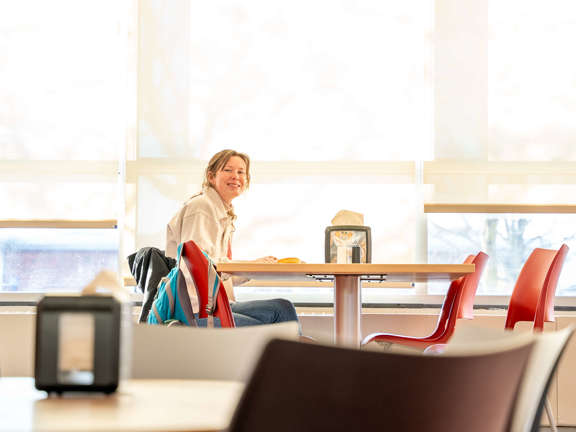 a student smiling at Roberts Wesleyan University