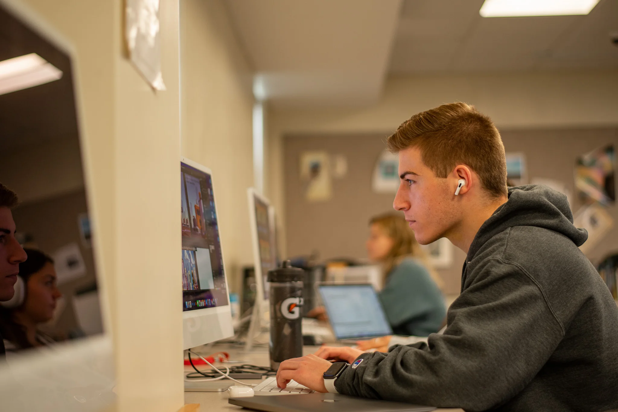 A student practices his graphic and digital design skills