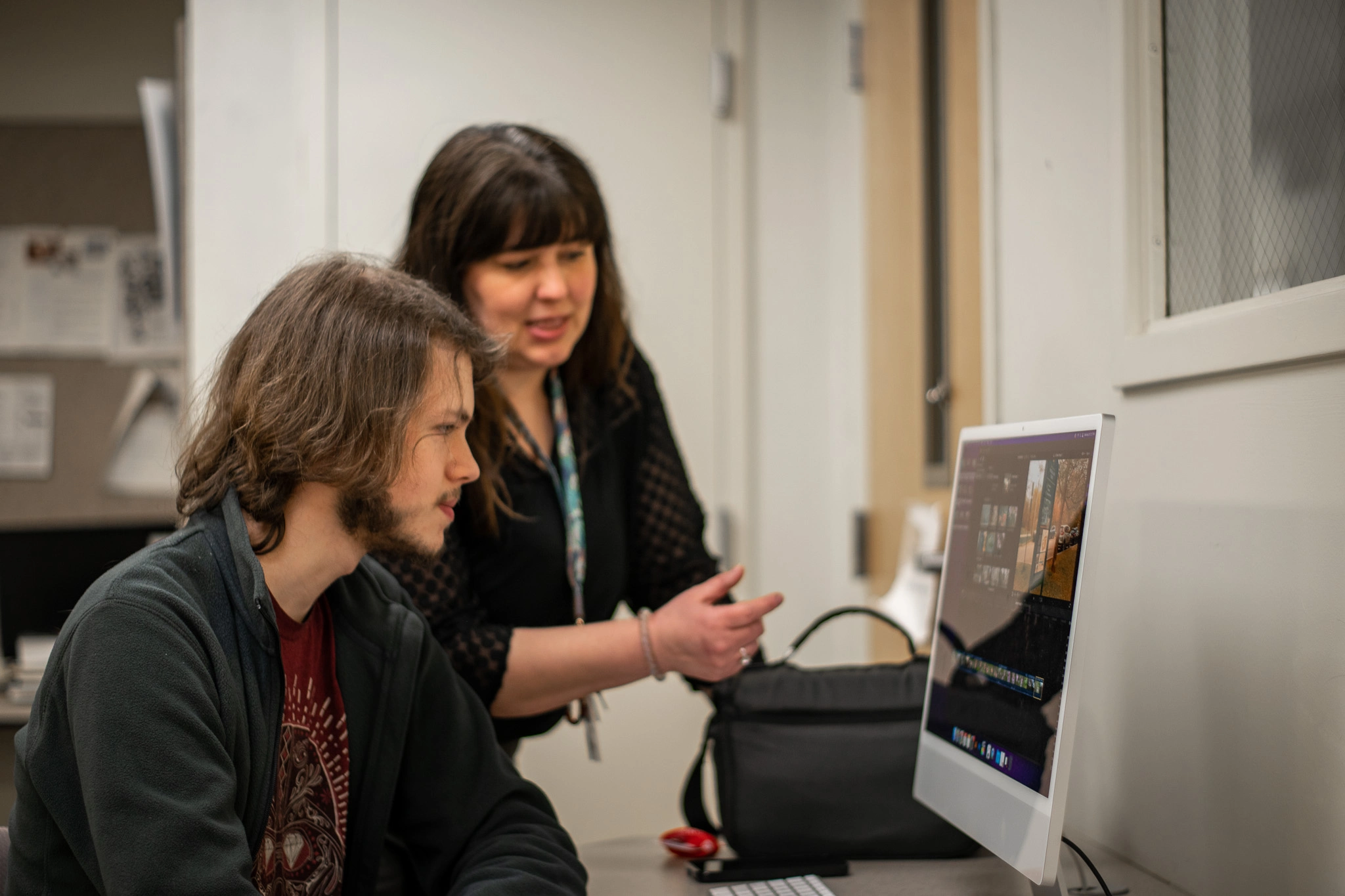 A Roberts Wesleyan Visual Art instructor with a student