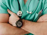A male nurse with his arms crossed
