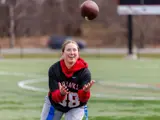 A student catching a football
