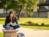 Student reads outside