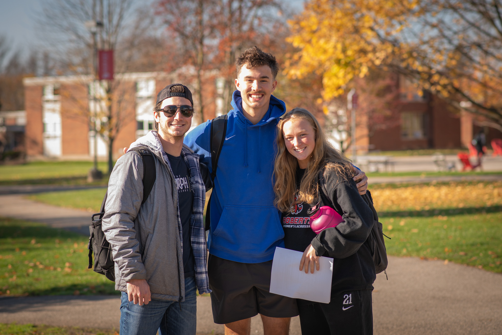 Three students standing outside